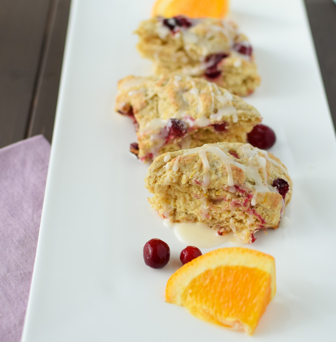 This Cranberry Orange Scone recipe combines tart flavor of cranberries with the bright fresh flavor oranges giving you the dish for a fall brunch party. 