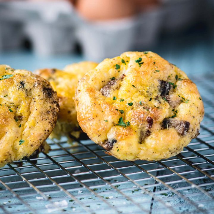 Close up of mini turkey sausage egg muffins on a cooling rack