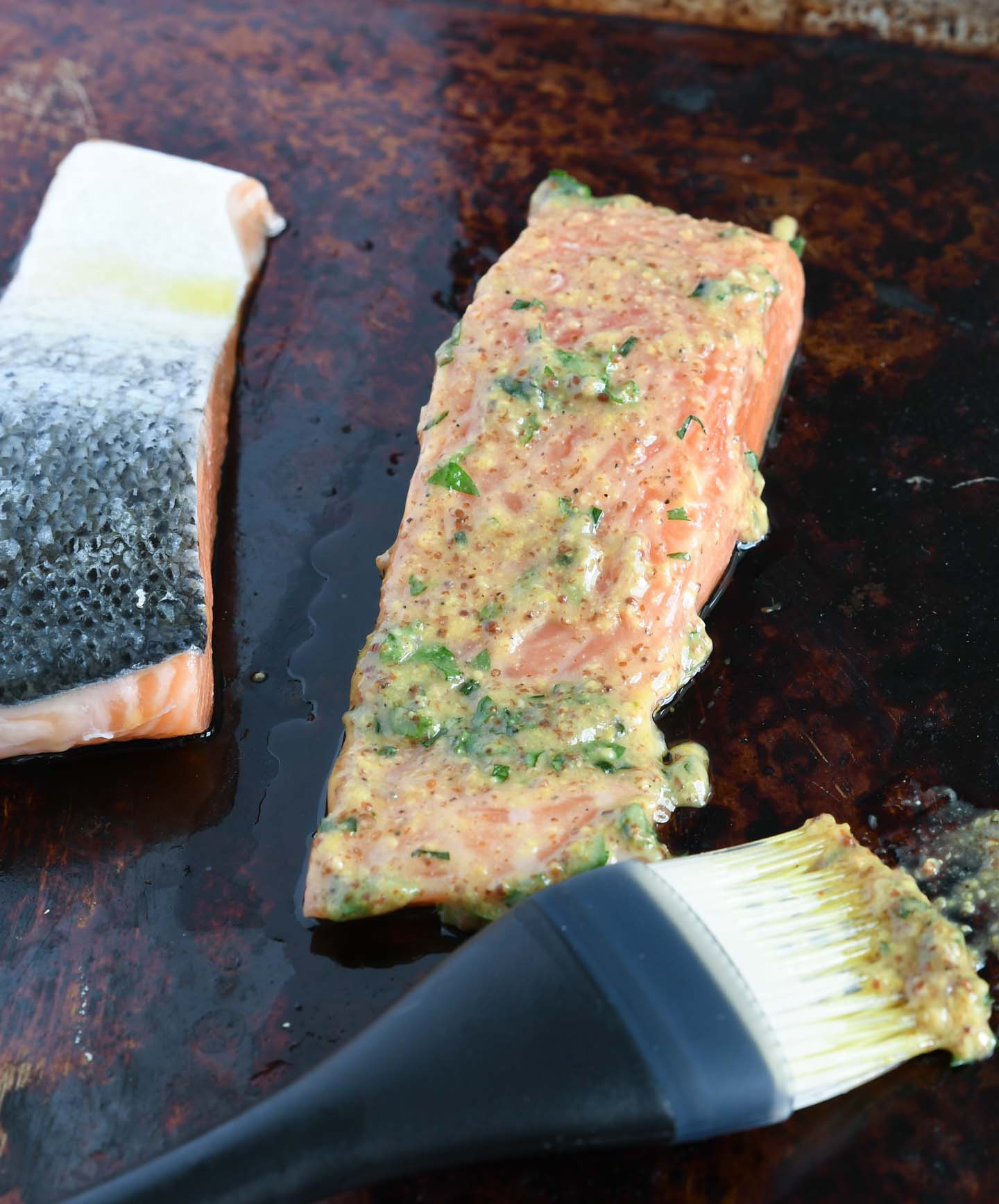 Uncooked salmon brushed with mustard sauce - ready for the grill