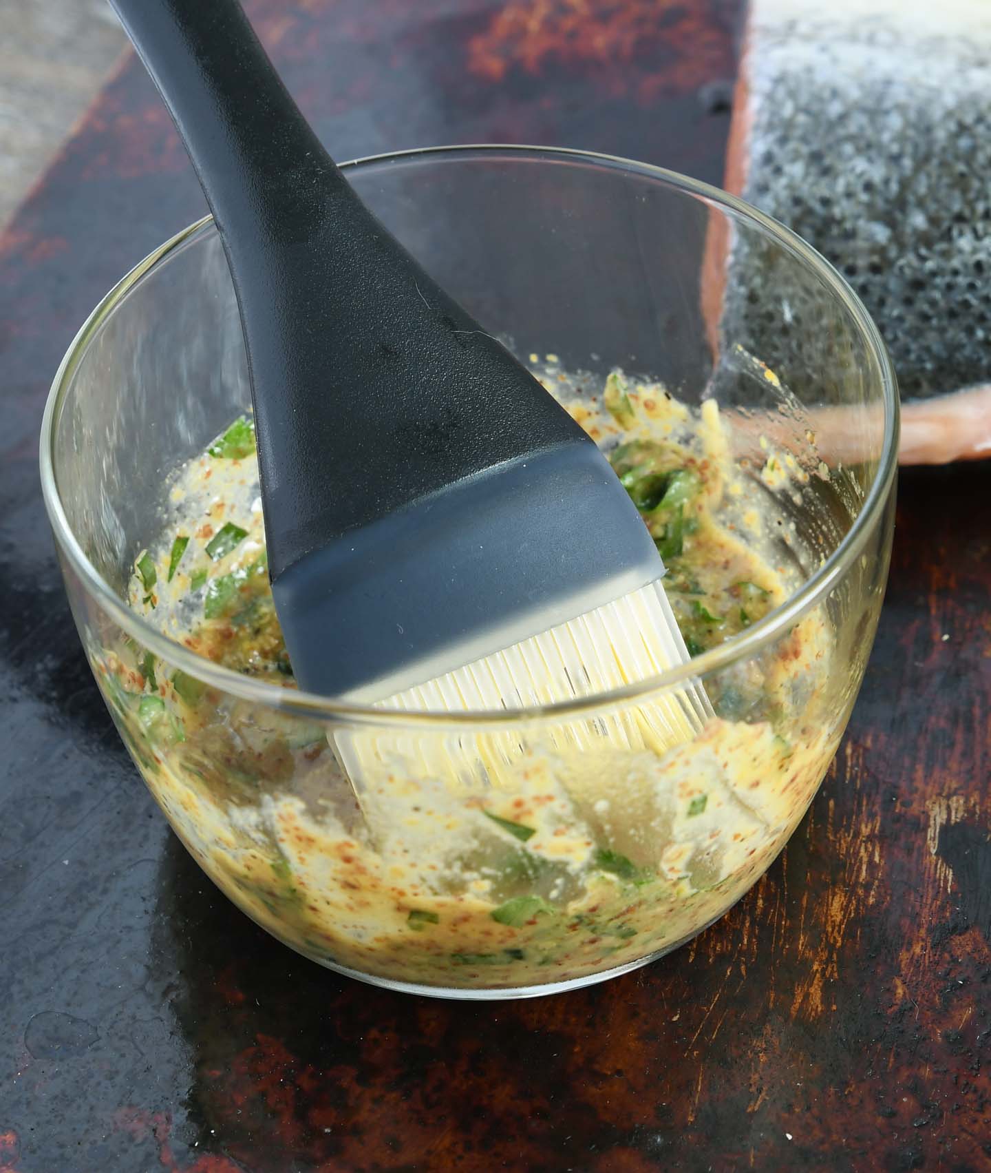 Tarragon mustard sauce in small bowl with brush