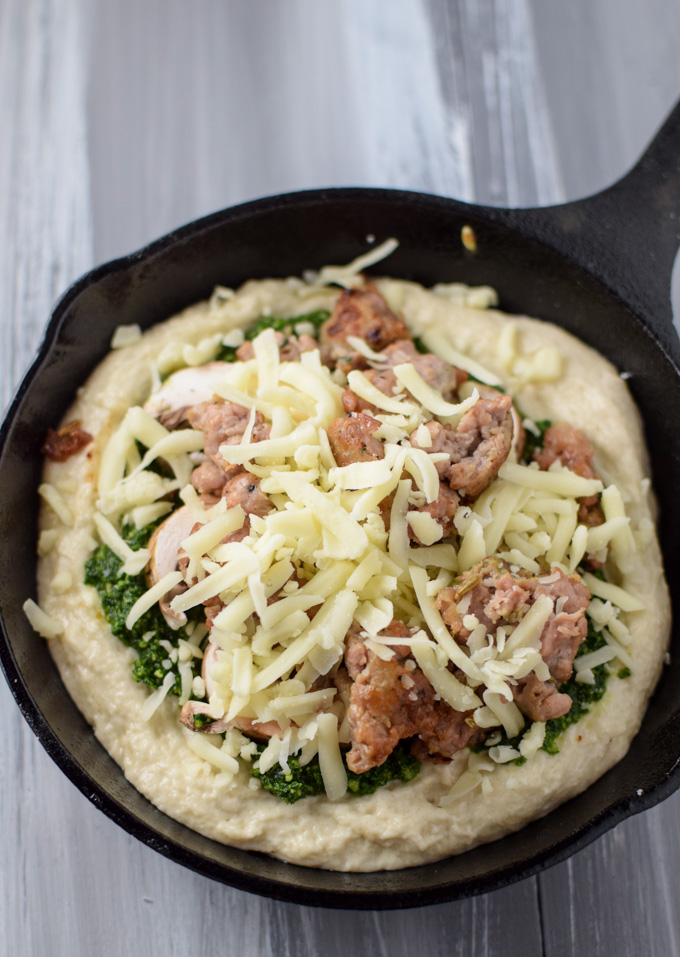 Kale Pesto Pizza in skillet ready to be cooked