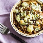 Caramelized onion tart topped with blue cheese shot from overhead