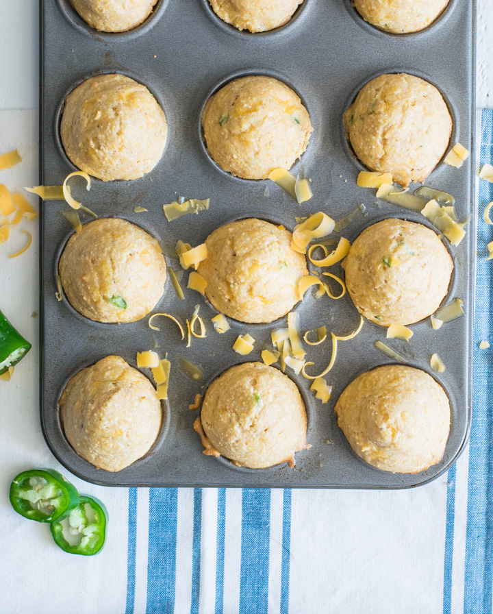 Mini muffin tin with baked jalapeno cornbread muffins