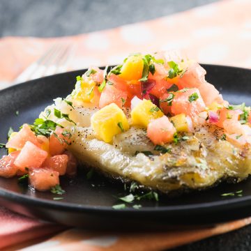 This grilled sea bass is topped with a light, refreshing watermelon mango salsa