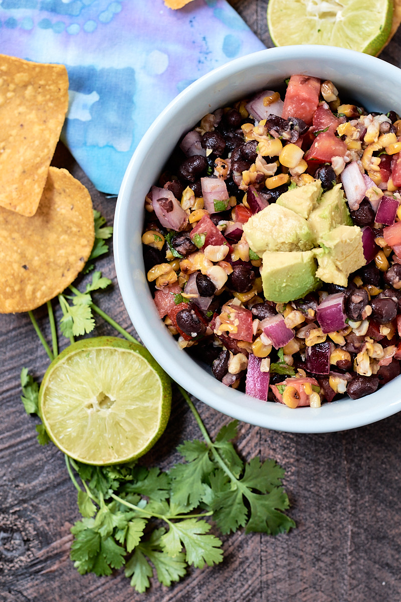 Light blue bowl filled with corn and black bean salsa