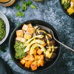 Overhead shot of Ancient Grains Bowl on a dark grey background