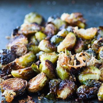 These crispy roasted brussels sprouts topped with parmesan and pomegranate simple syrup will give new meaning to the words side dish!  