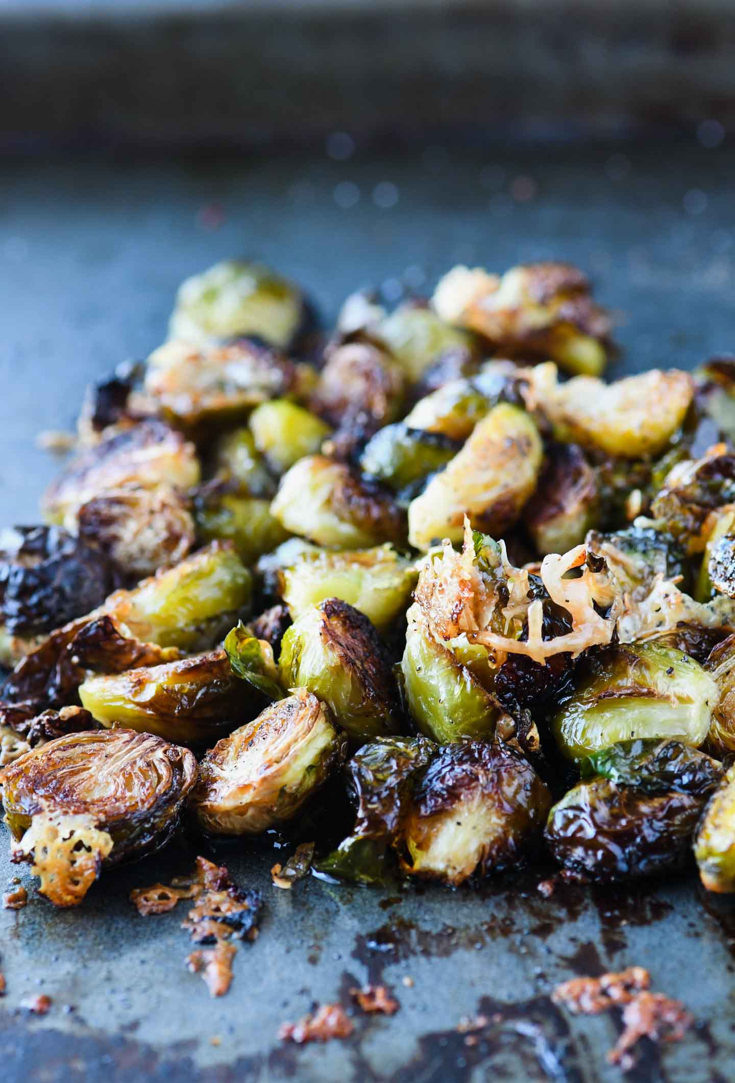 These crispy roasted brussels sprouts topped with parmesan and pomegranate simple syrup will give new meaning to the words side dish!  