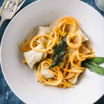 Ricotta gnocchi with brown butter sauce from overhead in a cream bowl