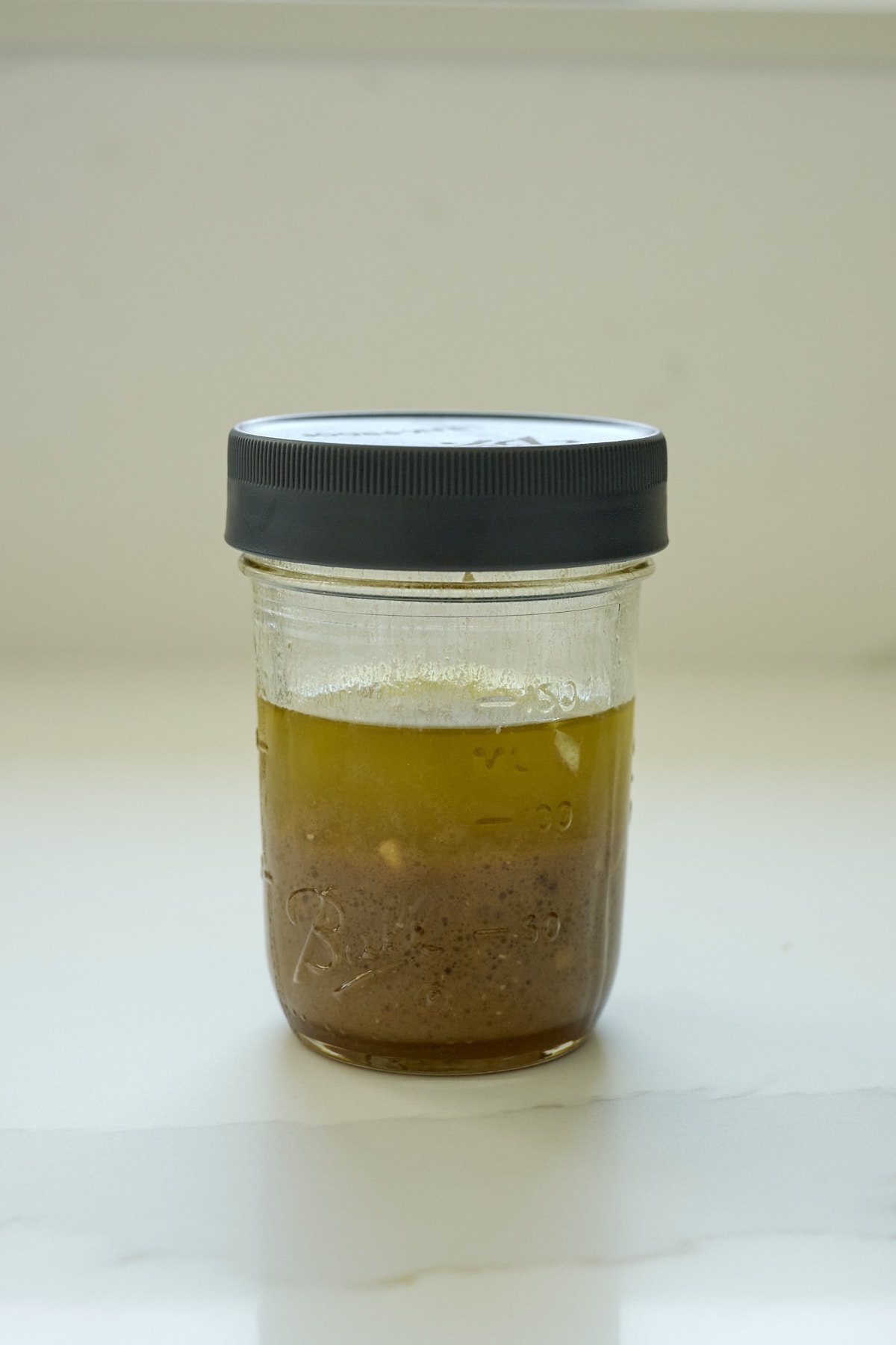 Balsamic dressing ingredients mixed in a mason jar