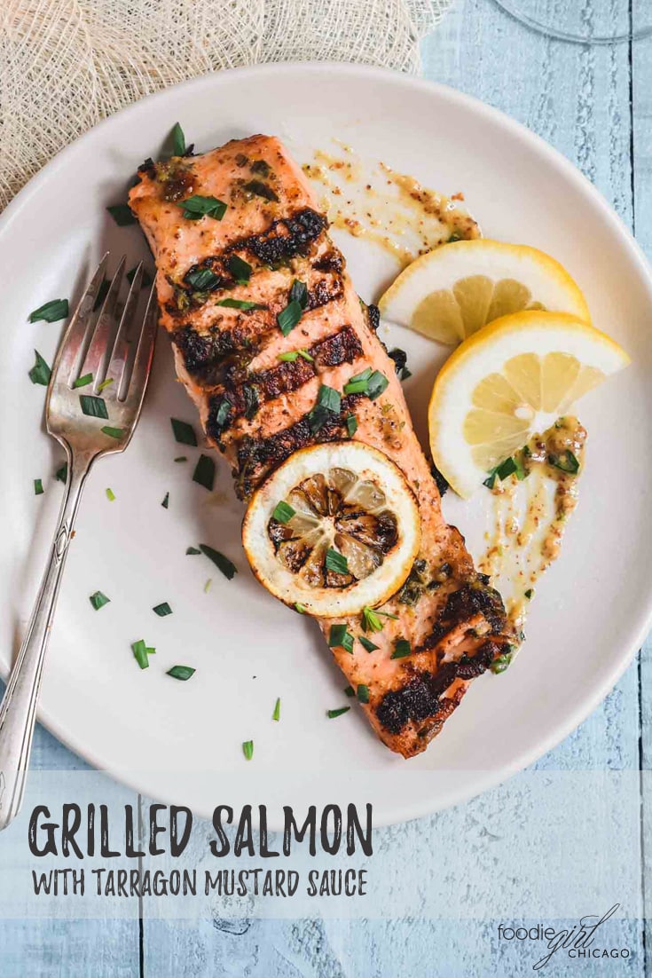 Grilled salmon filet with mustard sauce and tarragon leaves