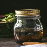 Small mason jar of homemade balsamic vinaigrette dressing