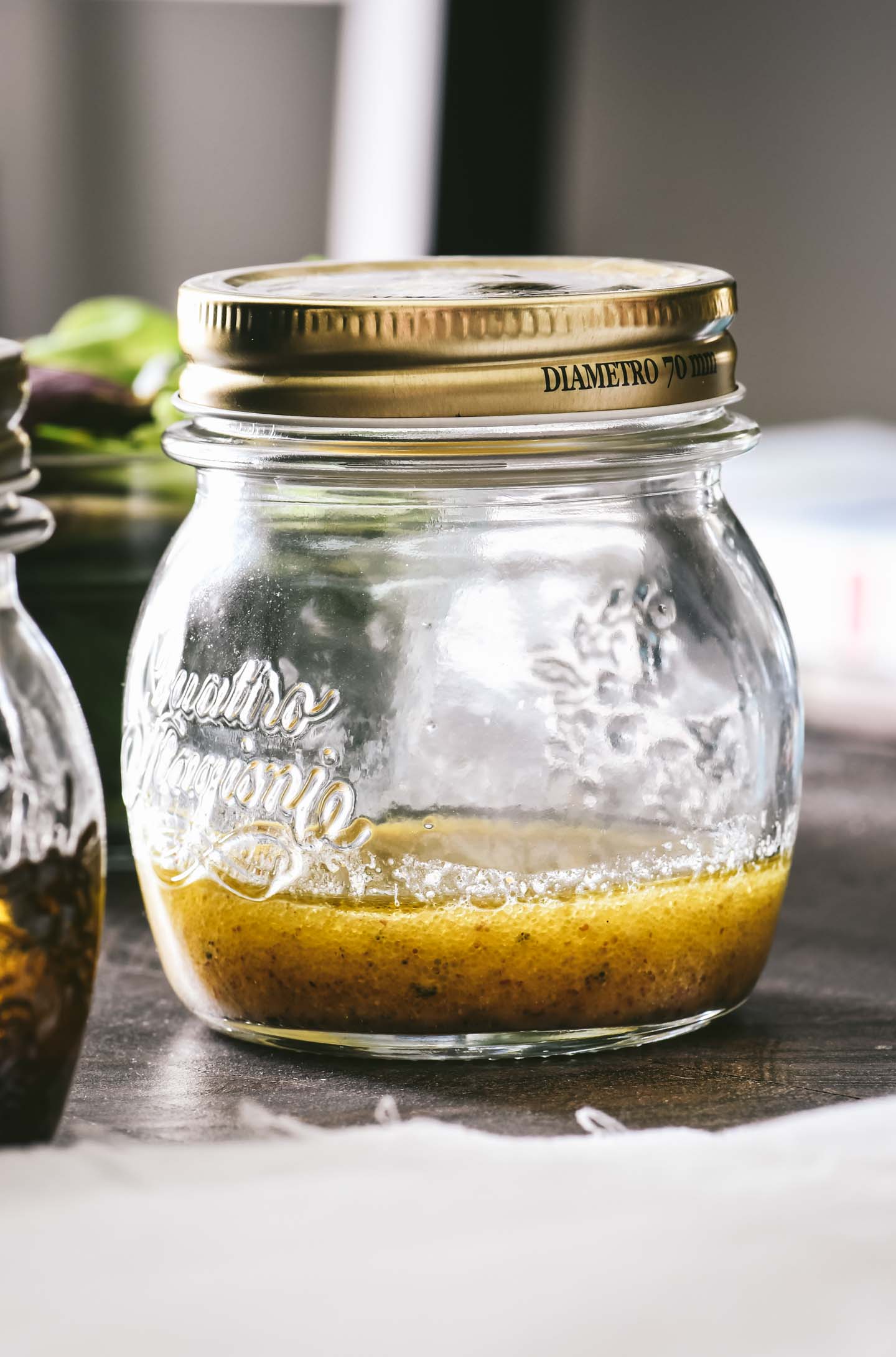 Small mason jar of champagne vinaigrette dressing