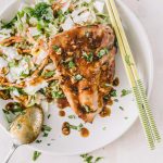 Grilled chicken breast topped with a Asian sauce on a bed of creamy cole slaw
