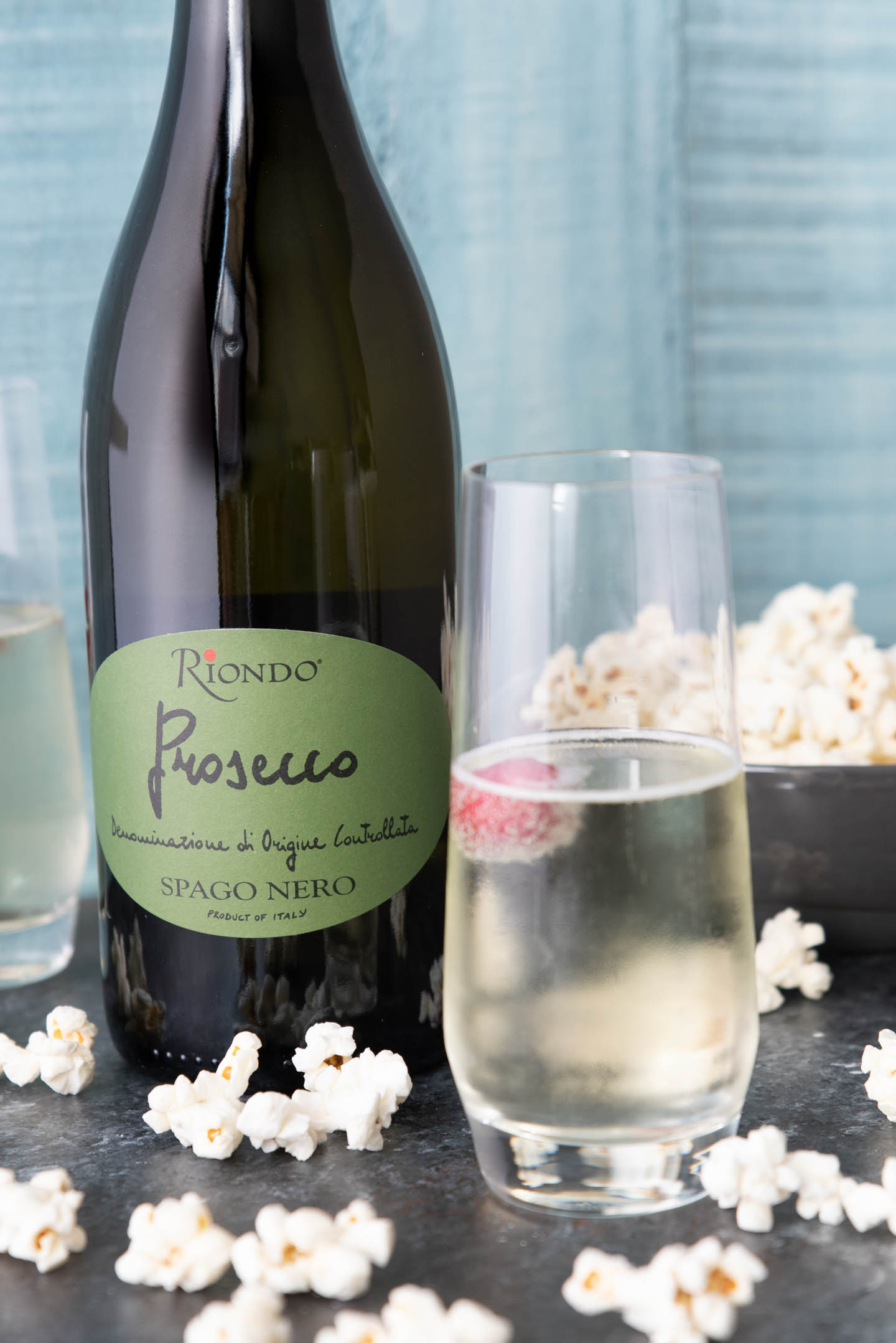 Prosecco cocktail with bottle of Riondo Prosecco