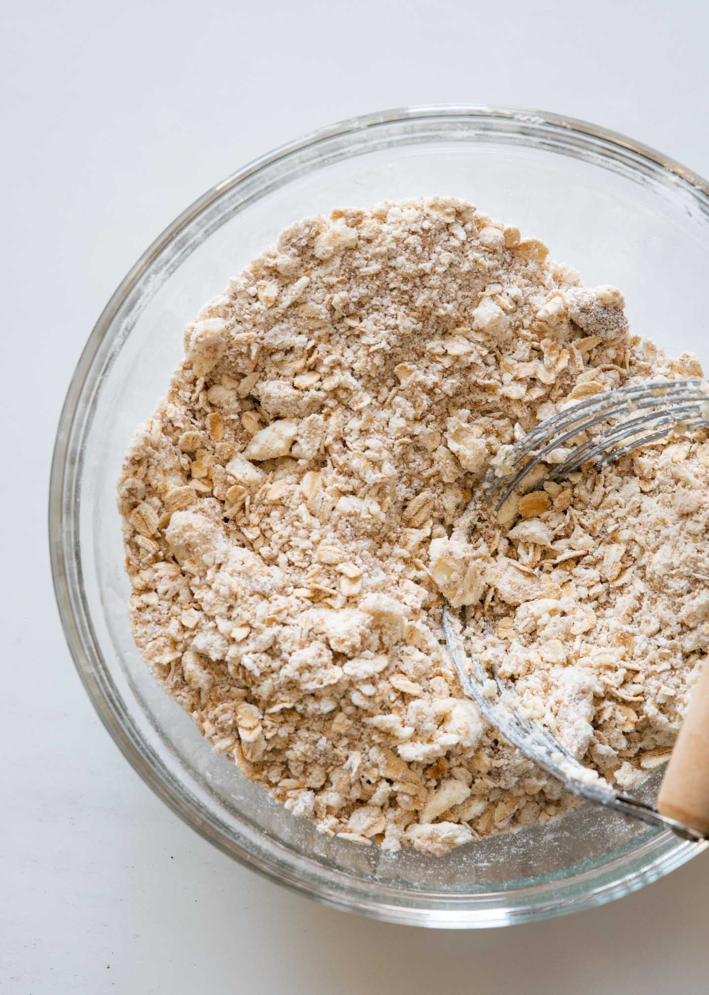 Mixing butter, flour and sugar for apple crisp topping. 