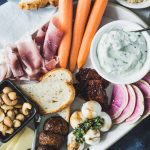 Platter with meat, cheese, veggies and toasted bread