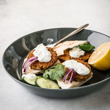 Baked falafel on toasted pita wedges topped with sauce