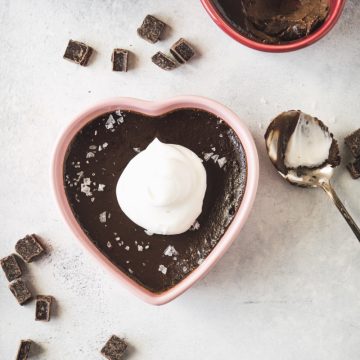 Espresso pot de creme in a pink heart dish topped with whipped cream