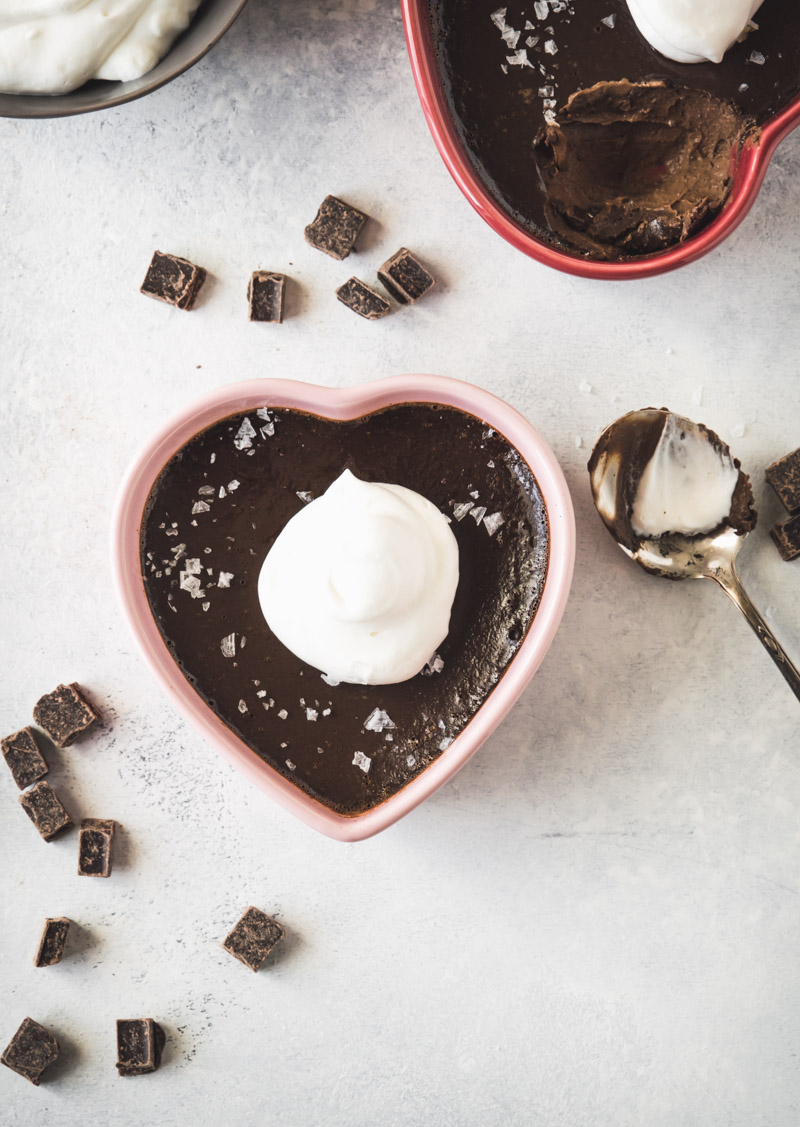 Espresso pot de creme in a pink heart dish topped with whipped cream