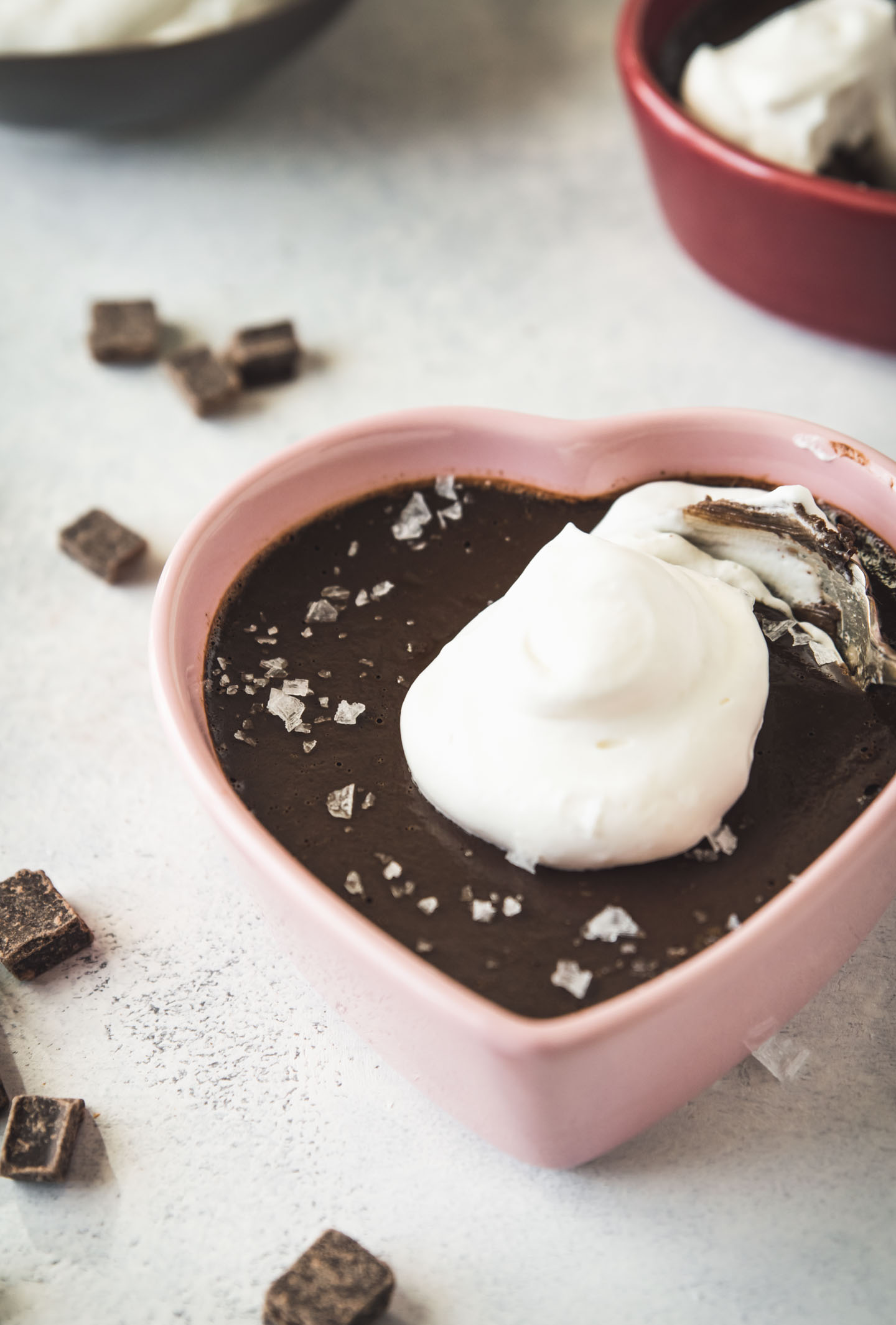 Espresso Chocolate Pot de Creme in a pink heart shaped dish topped with whipped cream