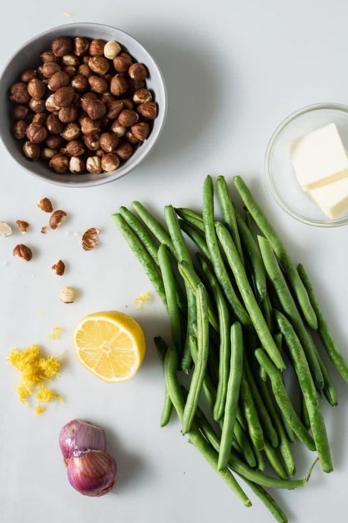 Recipe ingredients - green beans, lemon, hazelnuts, shallot and butter
