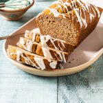 Loaf of banana bread with three slices cut