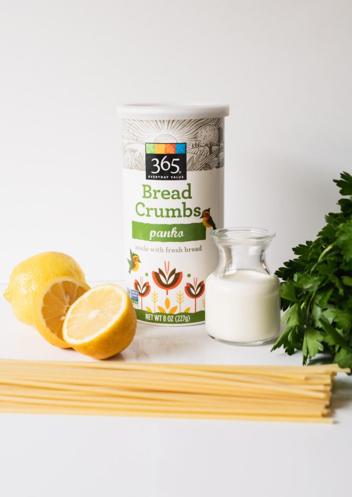 Ingredients for creamy lemon pasta - lemons, bucatini, panko bread crumbs, heavy cream and italian parsley