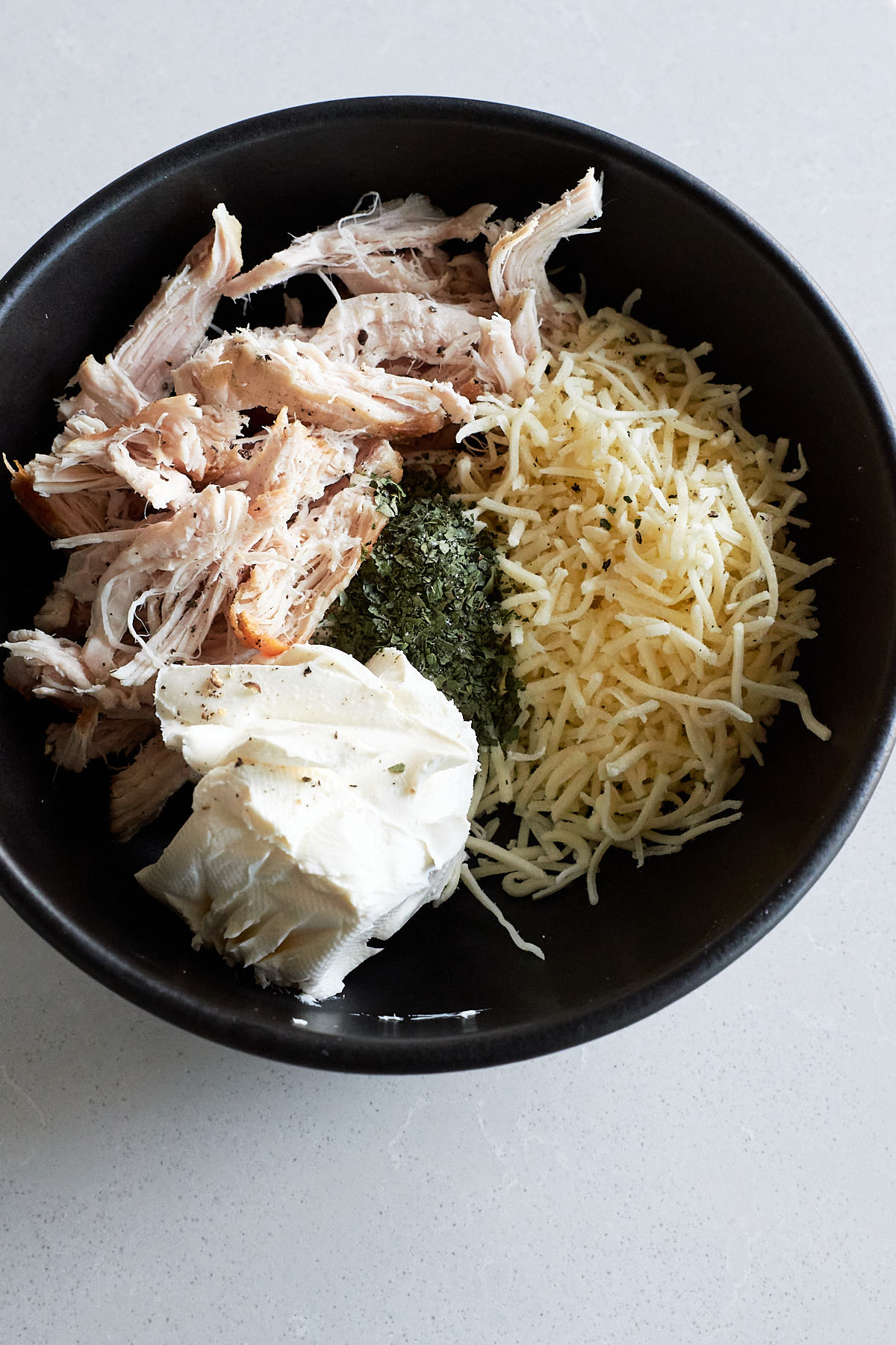 Flauta ingredients in a dark skillet