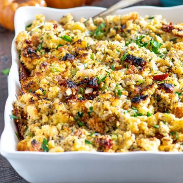 Cornbread stuffing in a while scallop edged serving dish