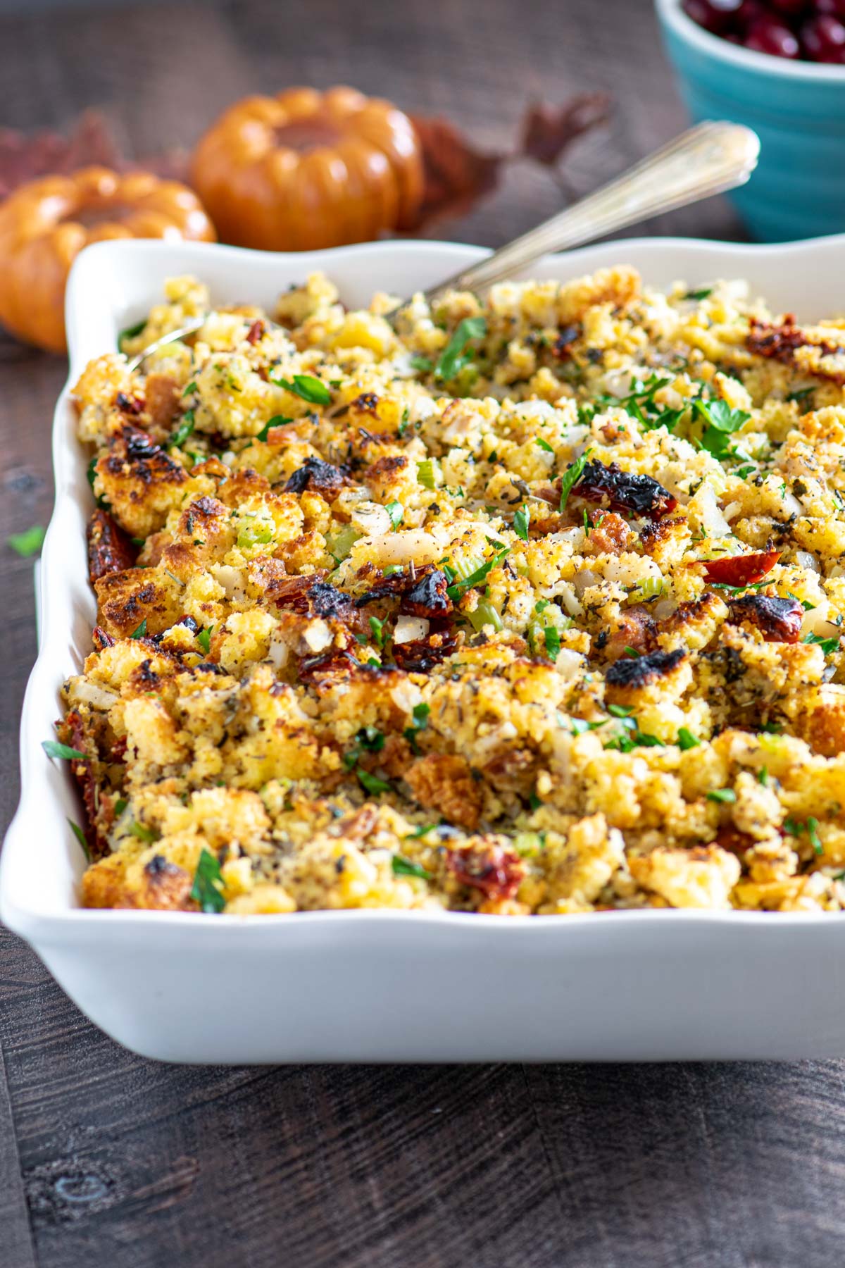 Cornbread stuffing in a while scallop edged serving dish