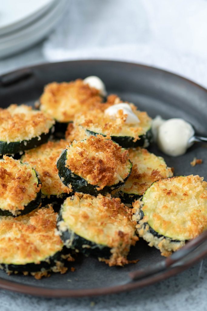 Close up of zucchini rounds breaded and air fried