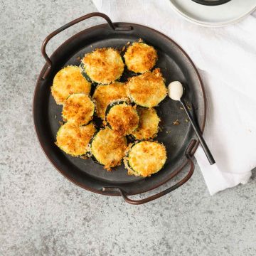 Air fried zucchini chips on a small metal platter with handles
