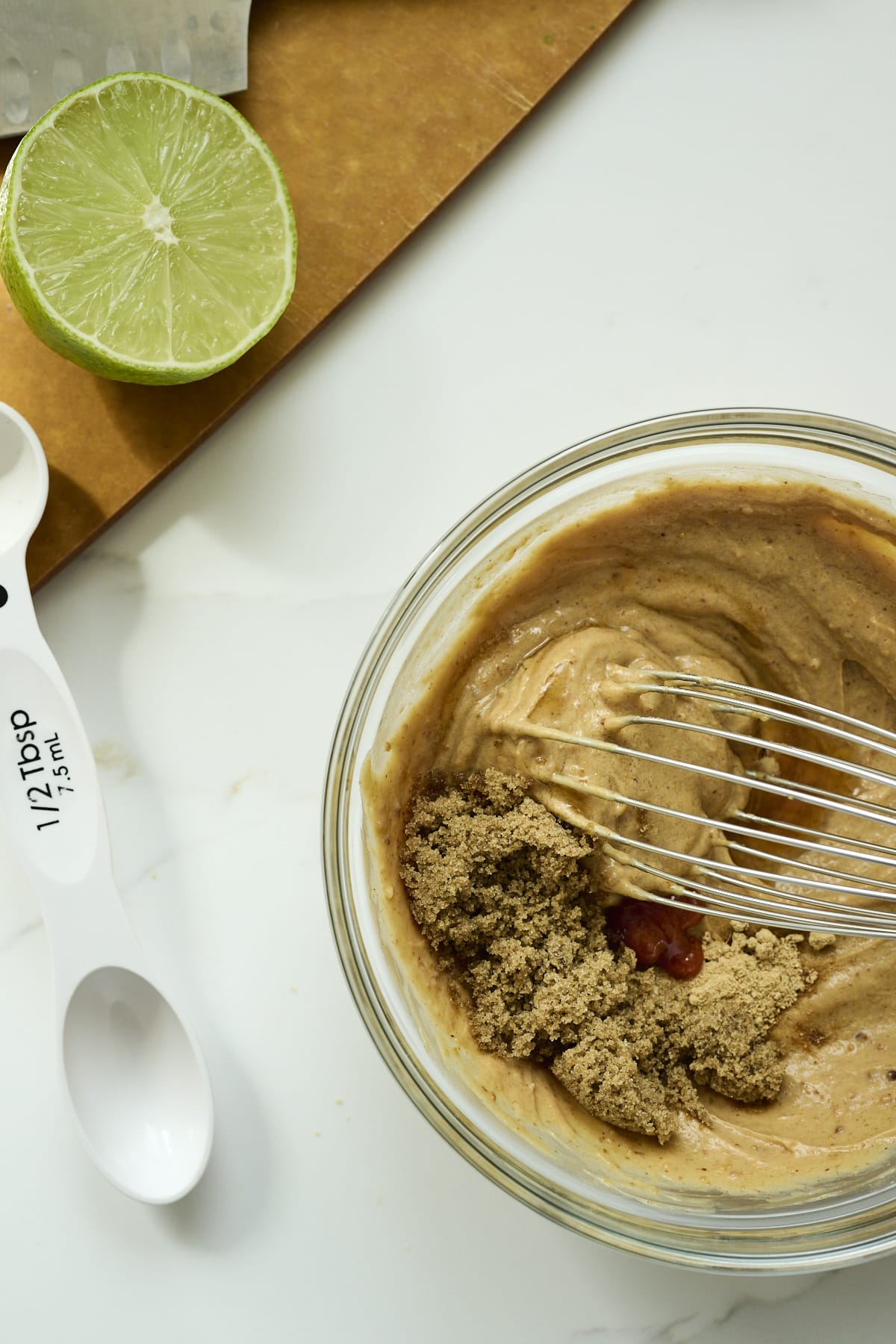 Ingredients for peanut sauce in a clear bowl