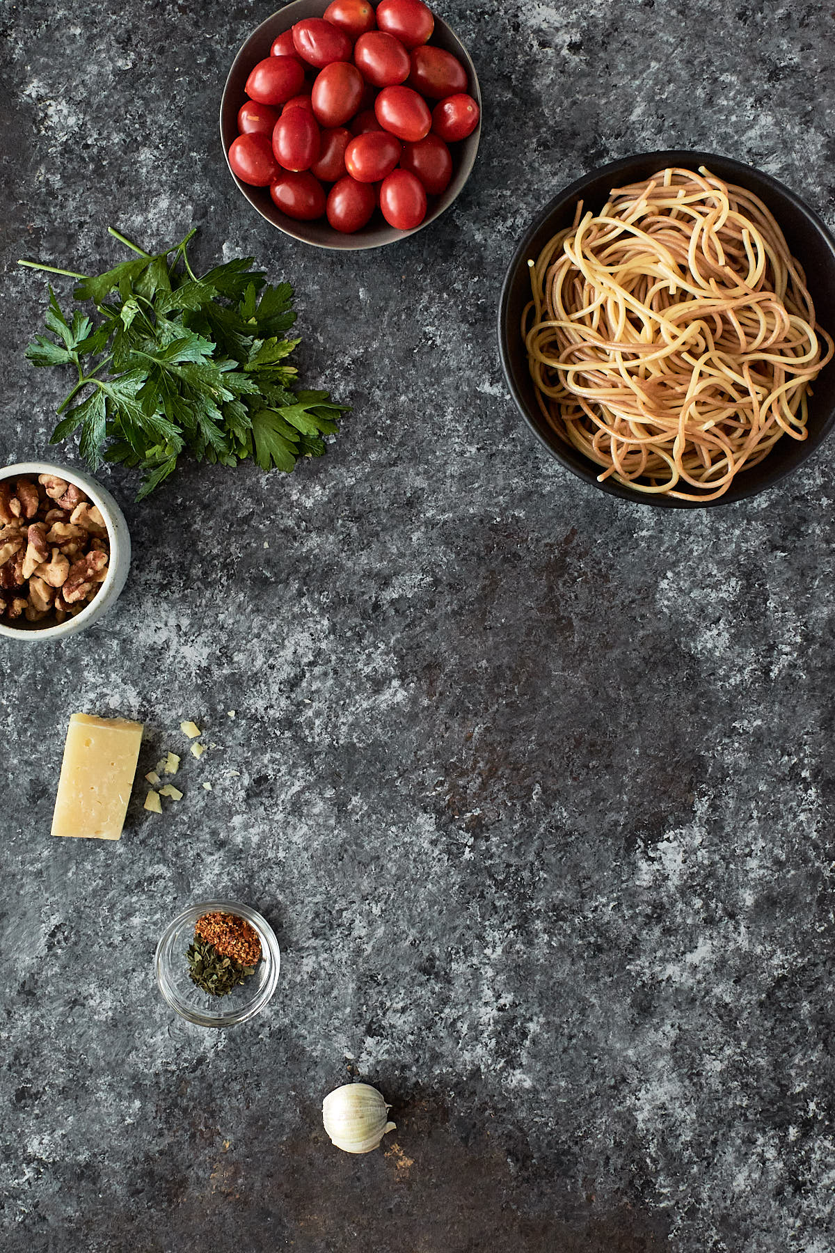 Recipe Ingredients | spaghetti, grape tomatoes, Italian parsley, walnuts, parmesan and garlic