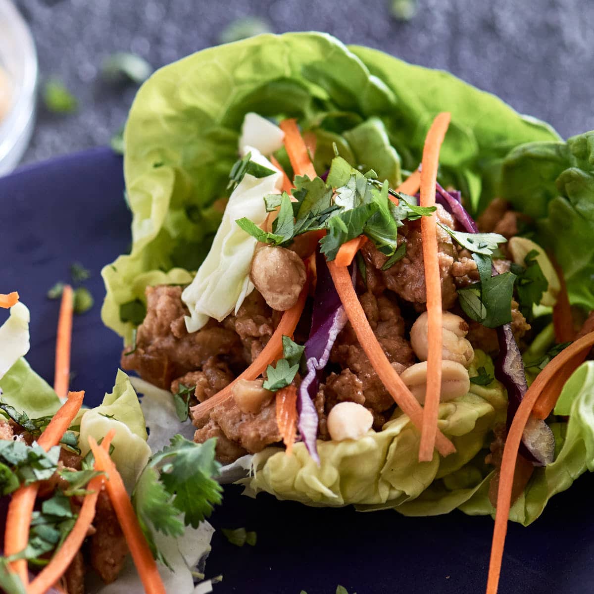 Overhead shot of butter lettuce leaves filled with Thai chicken filling