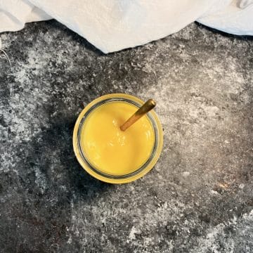 Small jar of lemon curd shot from overhead