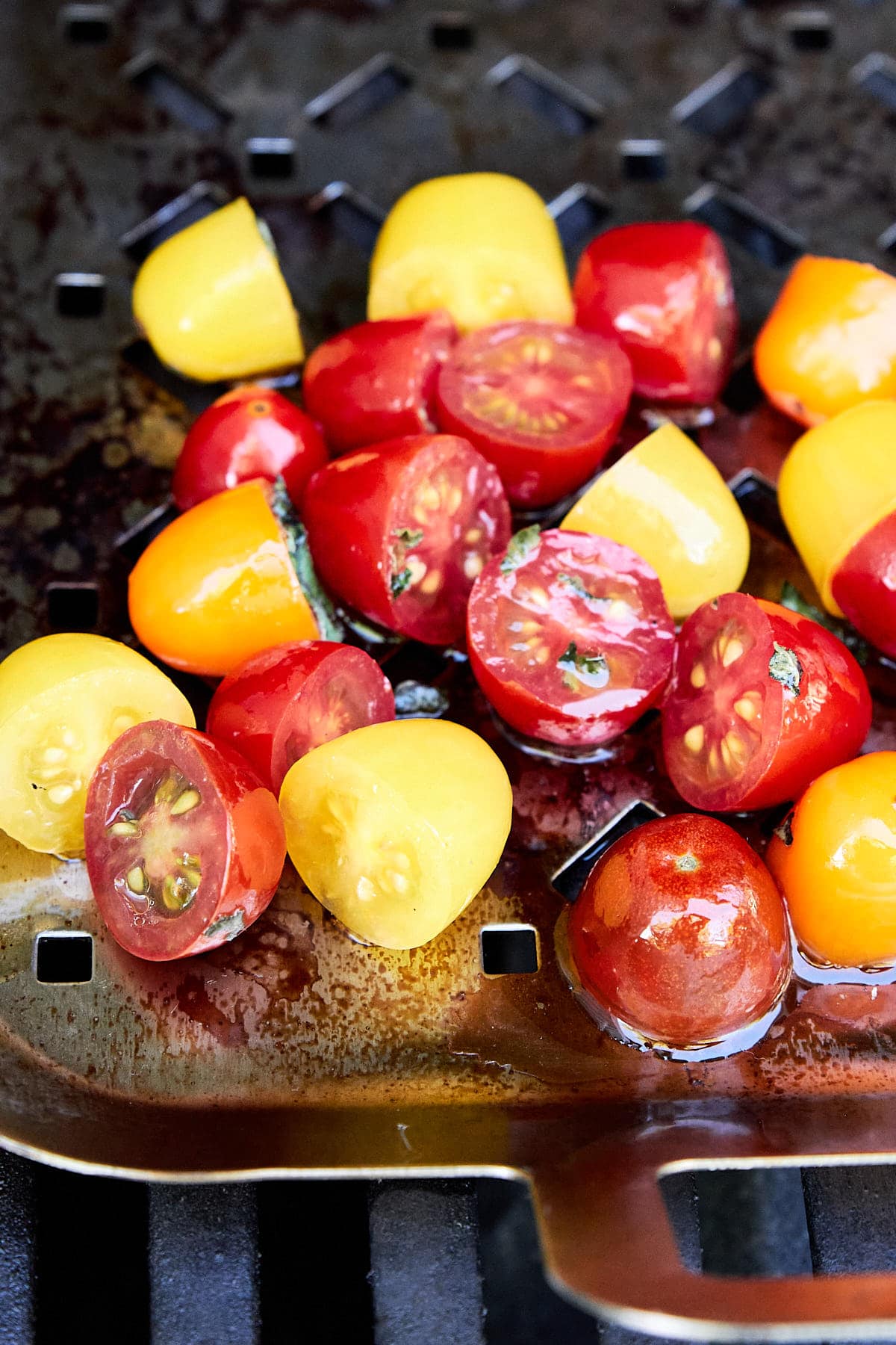 cut cherry tomatoes on a grill pan