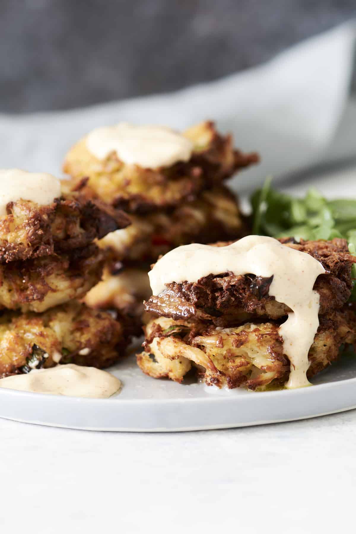 close up of a stack of air fried crab cakes