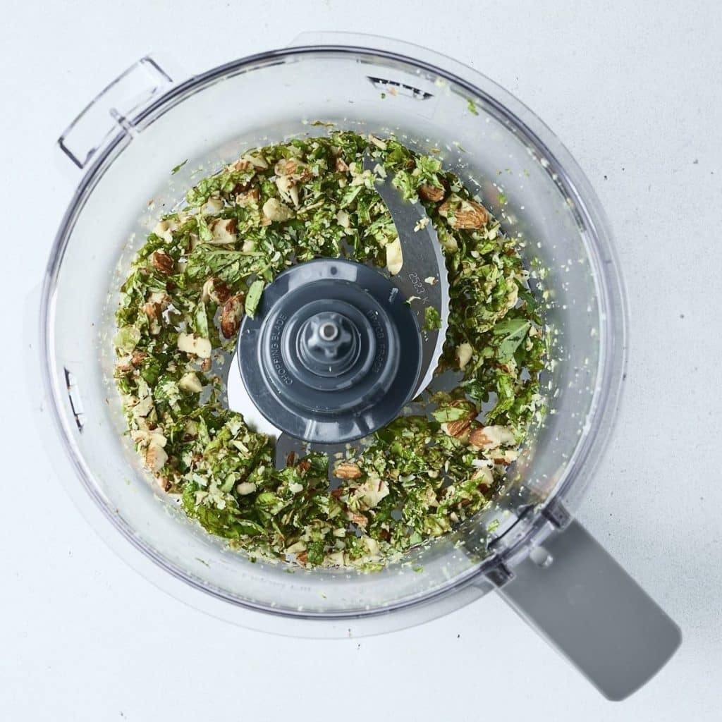 Basil, almonds, parmesan and olive oil in a food processor