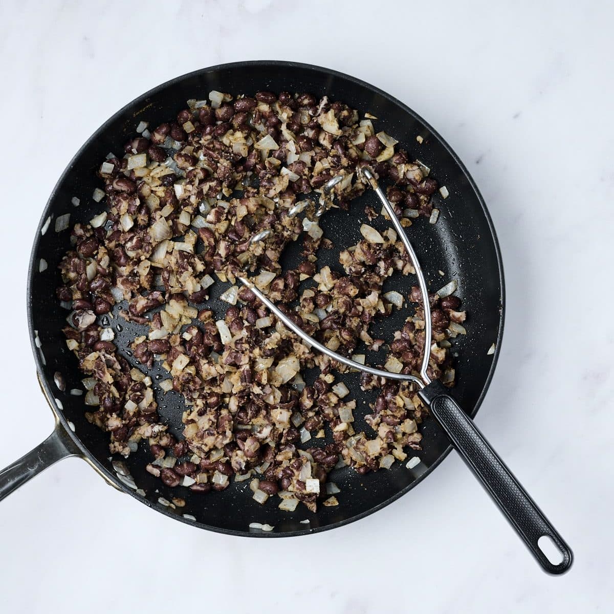 Black beans cooking in a skillet