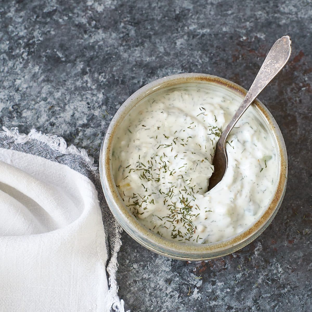 tzatziki sauce in a small grey bowl