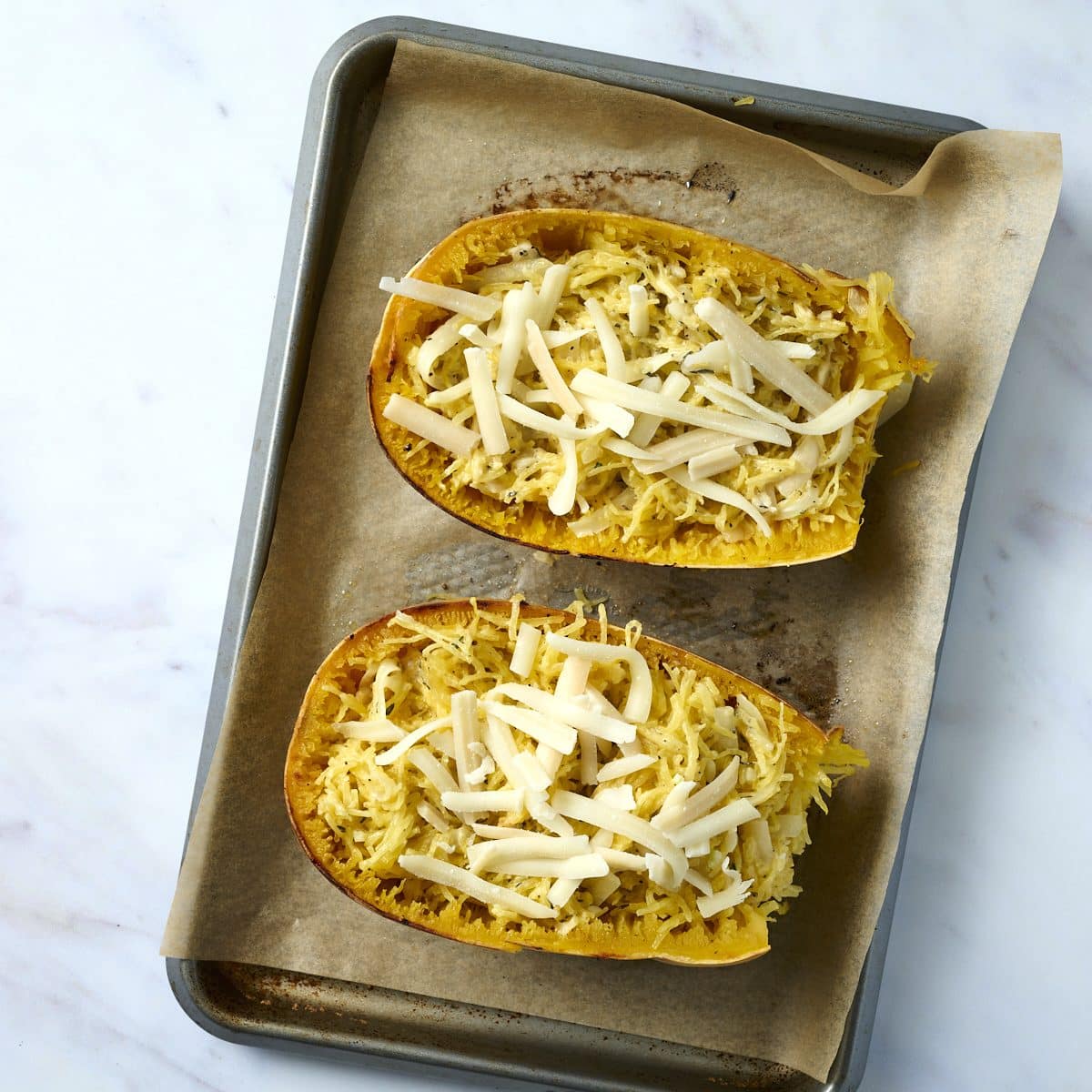 Stuffed spaghetti squash sprinkled with cheese