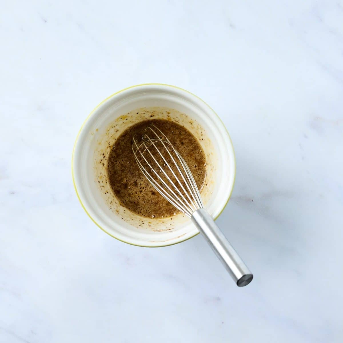 Eggs, sugar & chocolate mixture in a small bowl