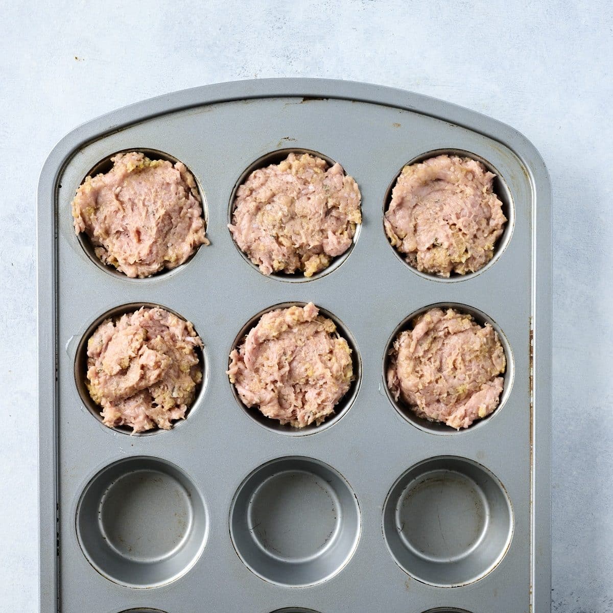 Turkey meatloaf mixture in muffin cups