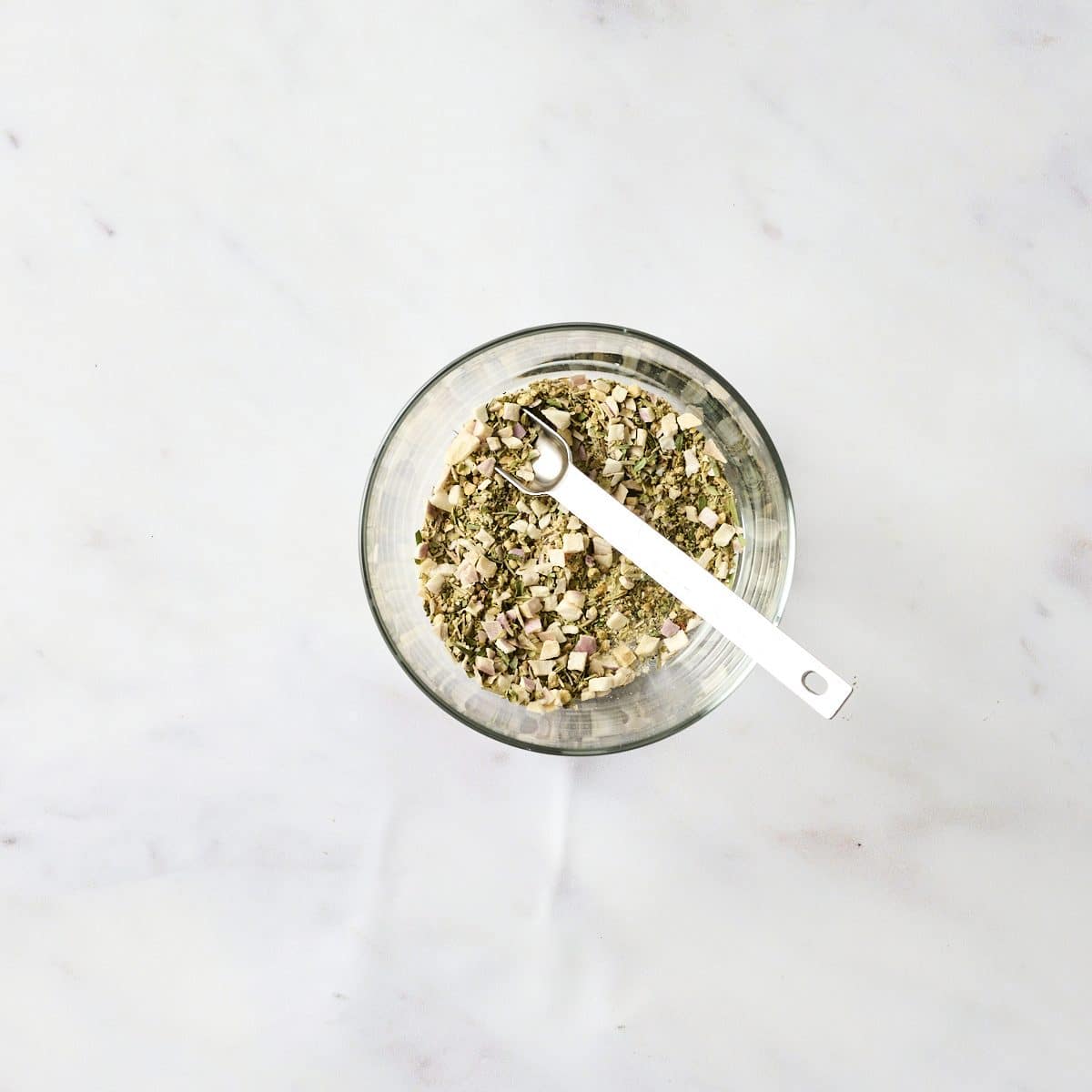 Panzanella salad dressing ingredients in a small glass bowl