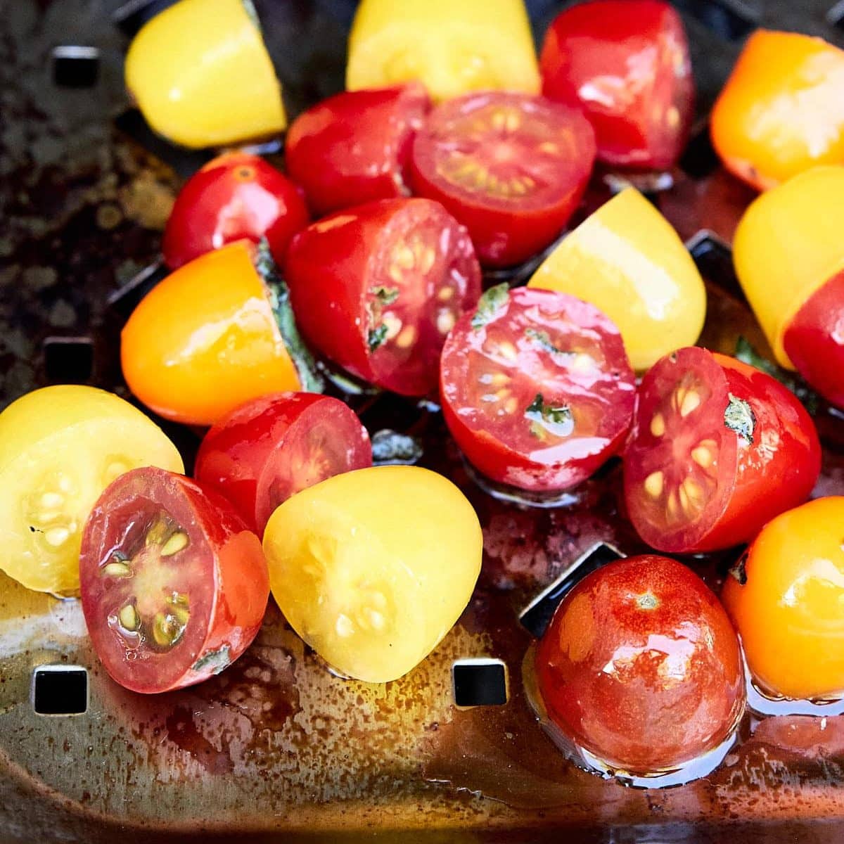 cut cherry tomatoes on a grill pan